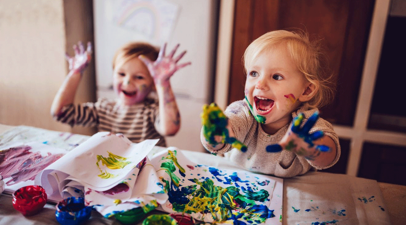 Cheerful-little-children-having-fun-doing-finger-painting-983418152_2125x1416